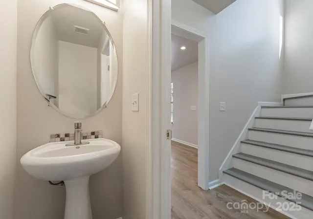 a bathroom with a sink and mirror