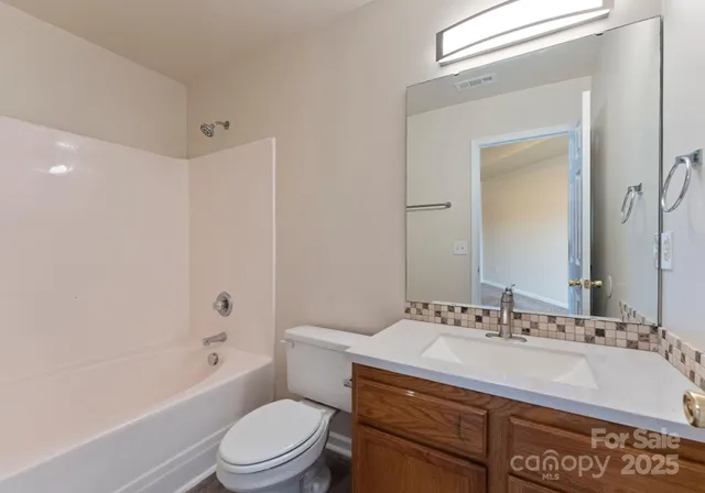 a bathroom with a sink a toilet and a bathtub