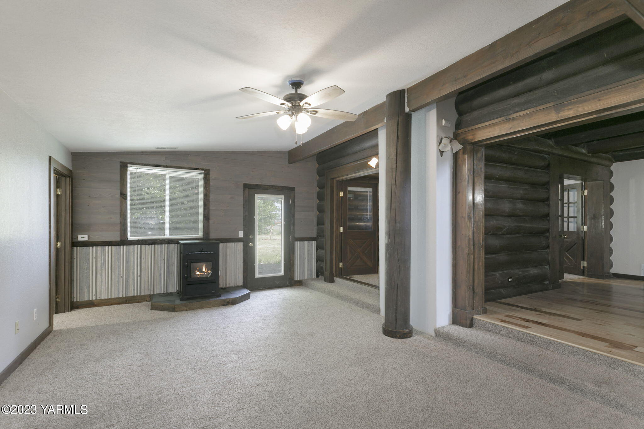 7903 Meadowbrook Road Yakima, WA 98903 - Photo 17 of 32 a view of a livingroom with a ceiling fan and window