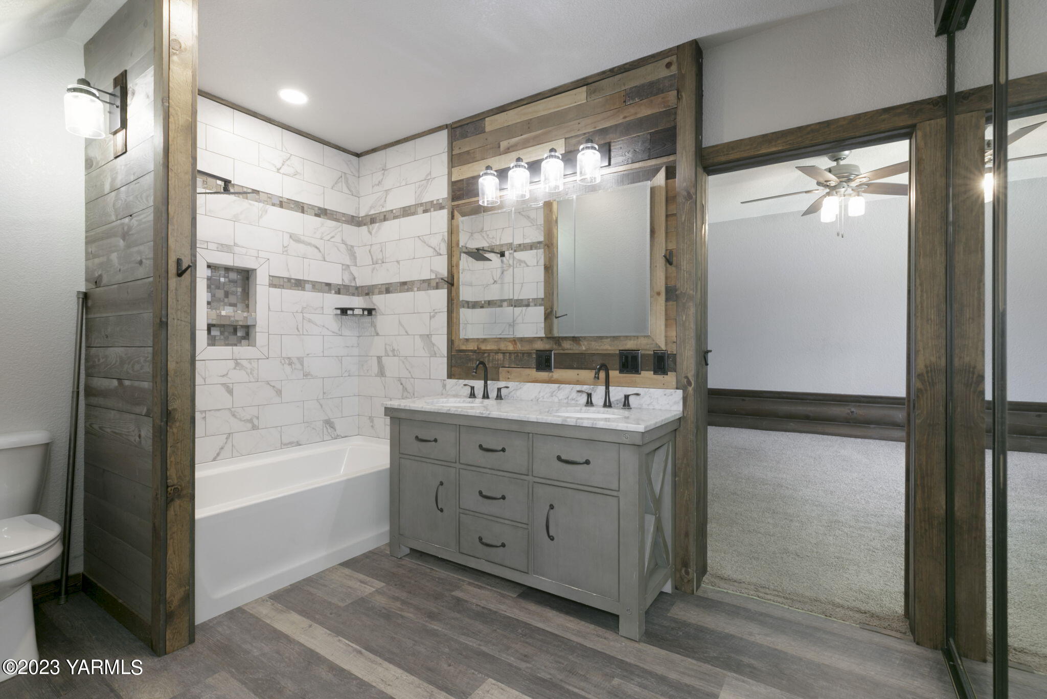 7903 Meadowbrook Road Yakima, WA 98903 - Photo 27 of 32 a bathroom with a granite countertop sink a toilet and shower