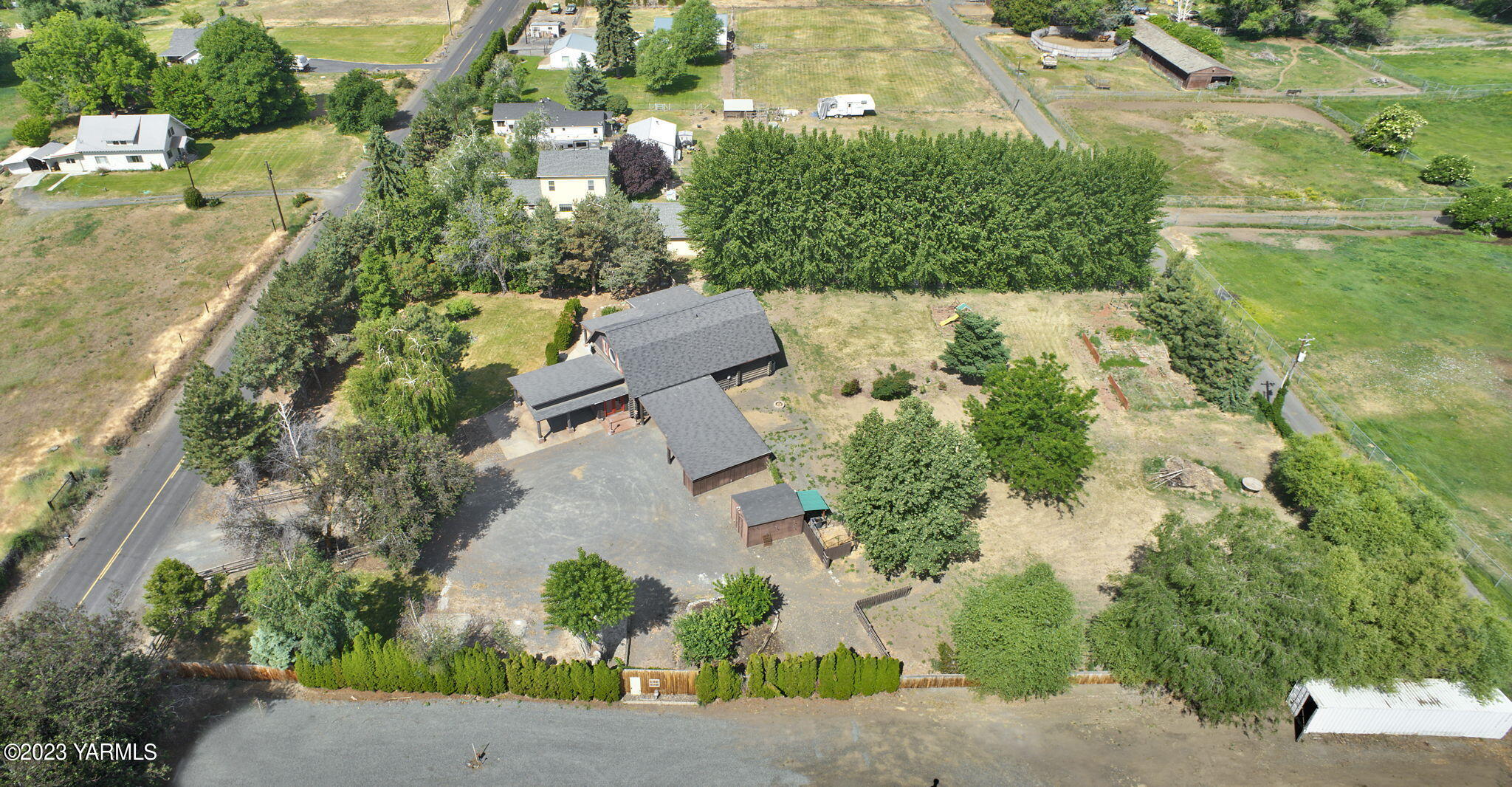 7903 Meadowbrook Road Yakima, WA 98903 - Photo 32 of 32 an aerial view of a house with a yard