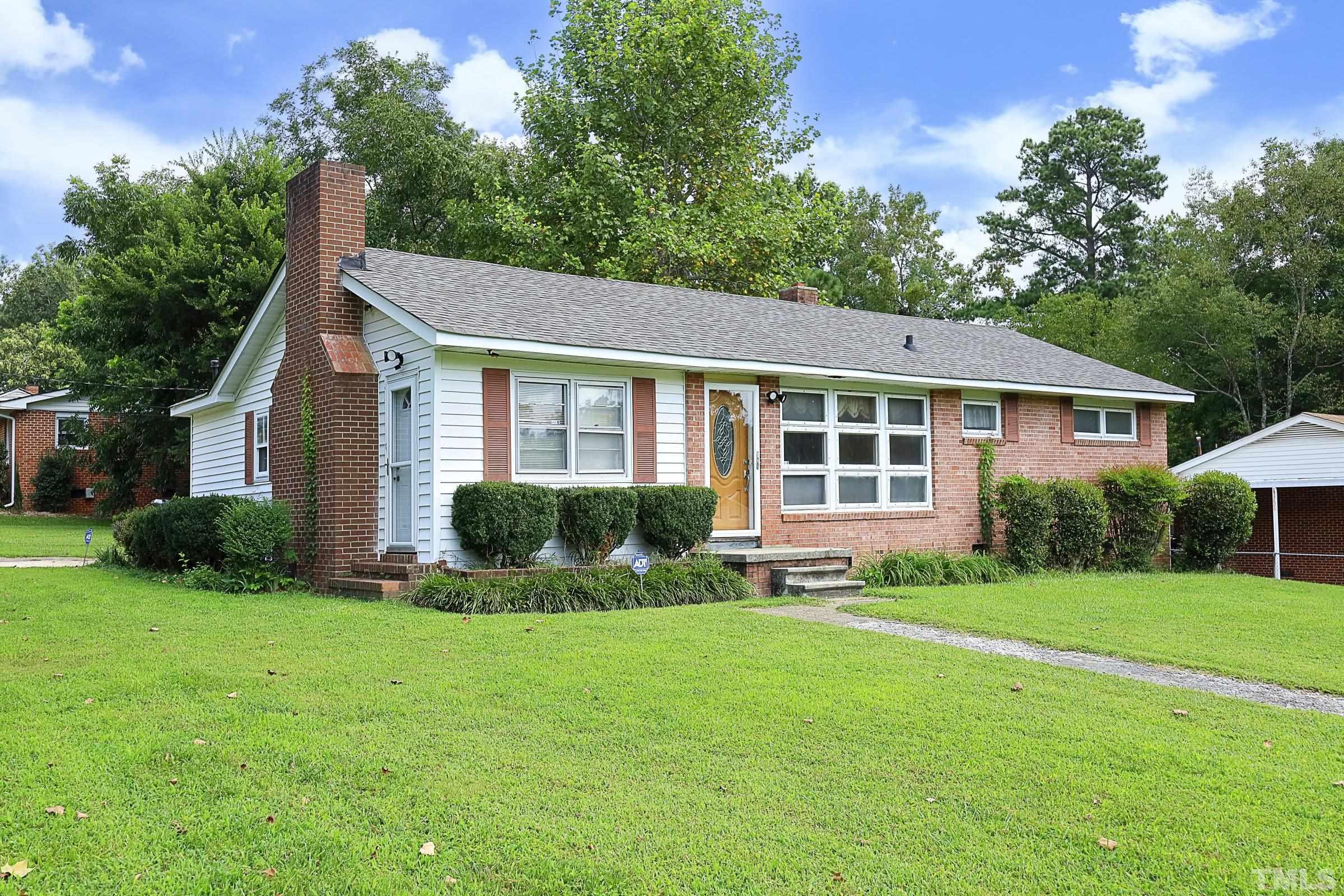 2801 Bromley Street Raleigh, NC 27610 - Photo 1 of 37 a view of a house with a yard and plants