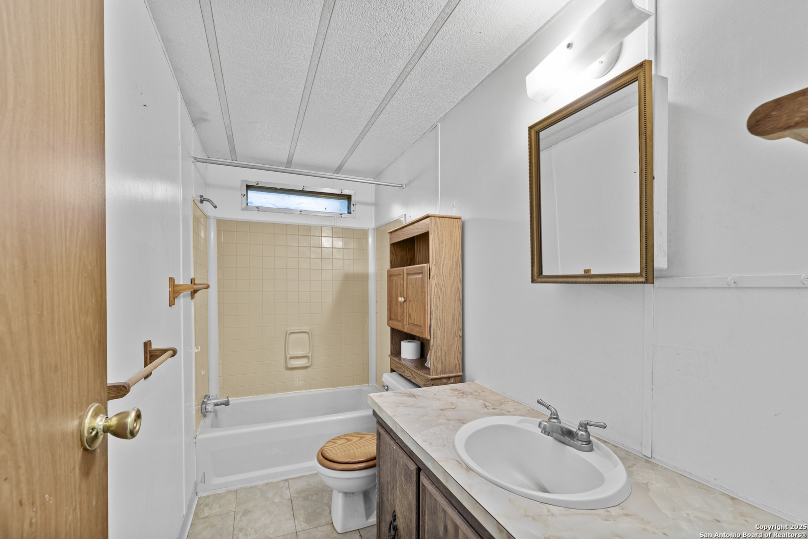 1189 Vivroux Ranch Road Seguin, TX 78155 - Photo 14 of 24 a bathroom with a sink toilet and shower