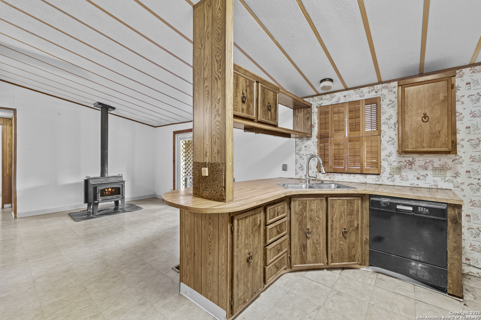 1189 Vivroux Ranch Road Seguin, TX 78155 - Photo 17 of 24 a kitchen with stainless steel appliances granite countertop a sink and cabinets