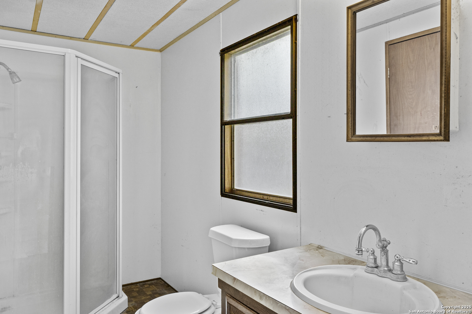 1189 Vivroux Ranch Road Seguin, TX 78155 - Photo 19 of 24 a bathroom with a toilet sink and mirror