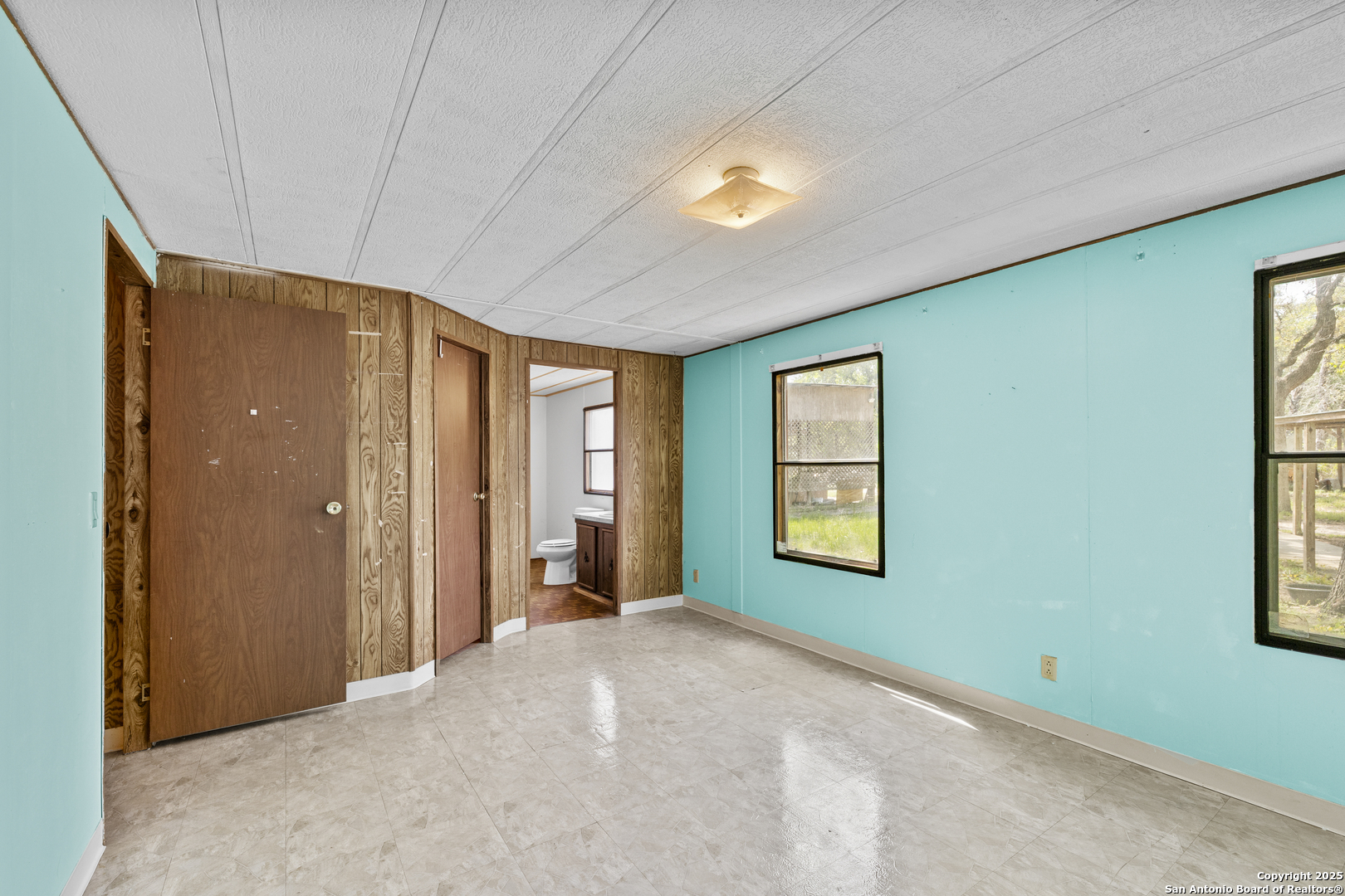 1189 Vivroux Ranch Road Seguin, TX 78155 - Photo 20 of 24 a view of a big room with windows and bathroom