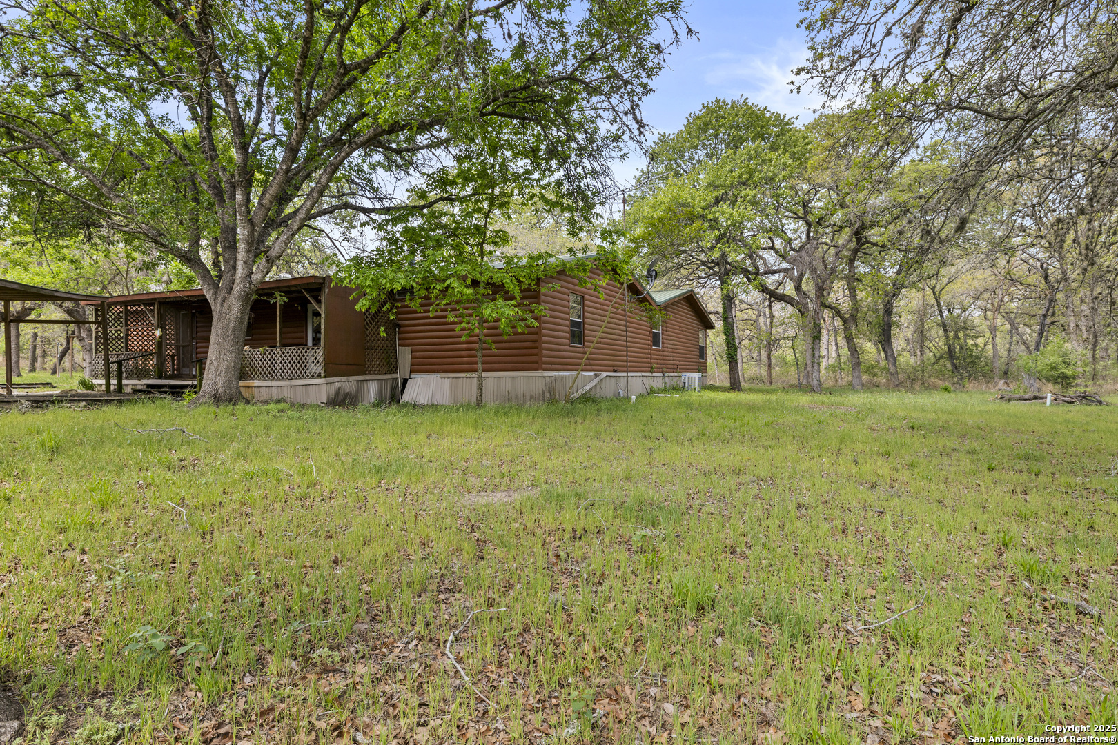 1189 Vivroux Ranch Road Seguin, TX 78155 - Photo 2 of 24 a view of a house with a yard