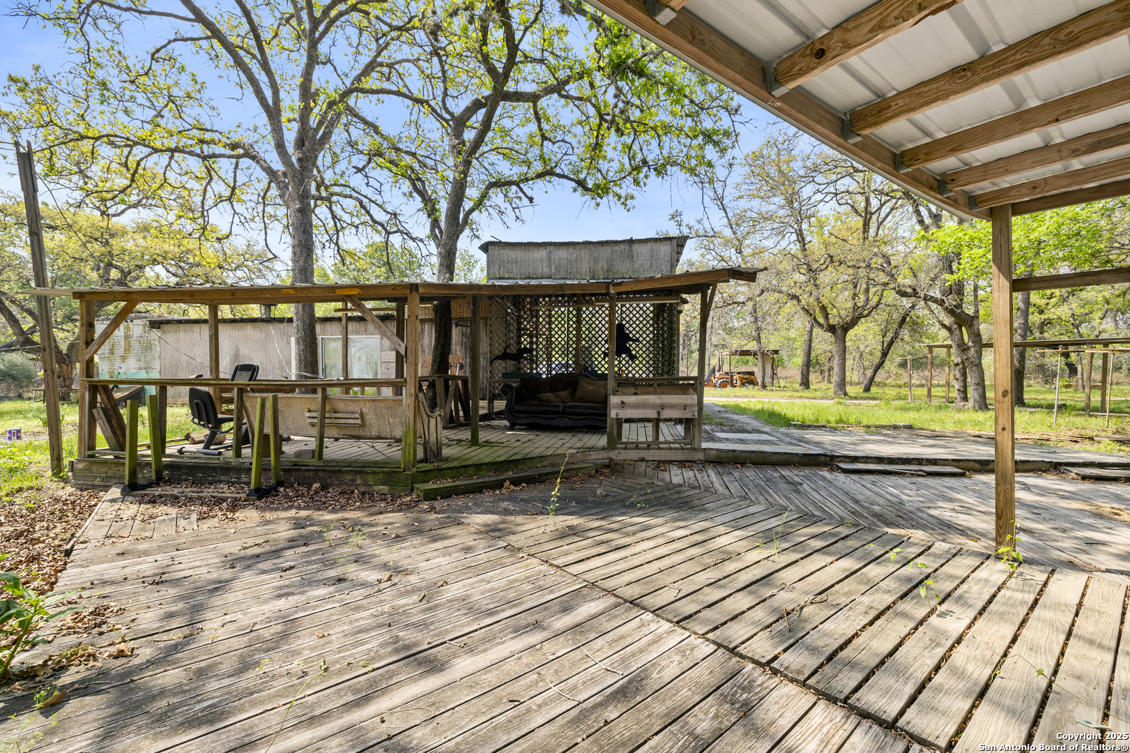 1189 Vivroux Ranch Road Seguin, TX 78155 - Photo 22 of 24 a view of a house with a yard