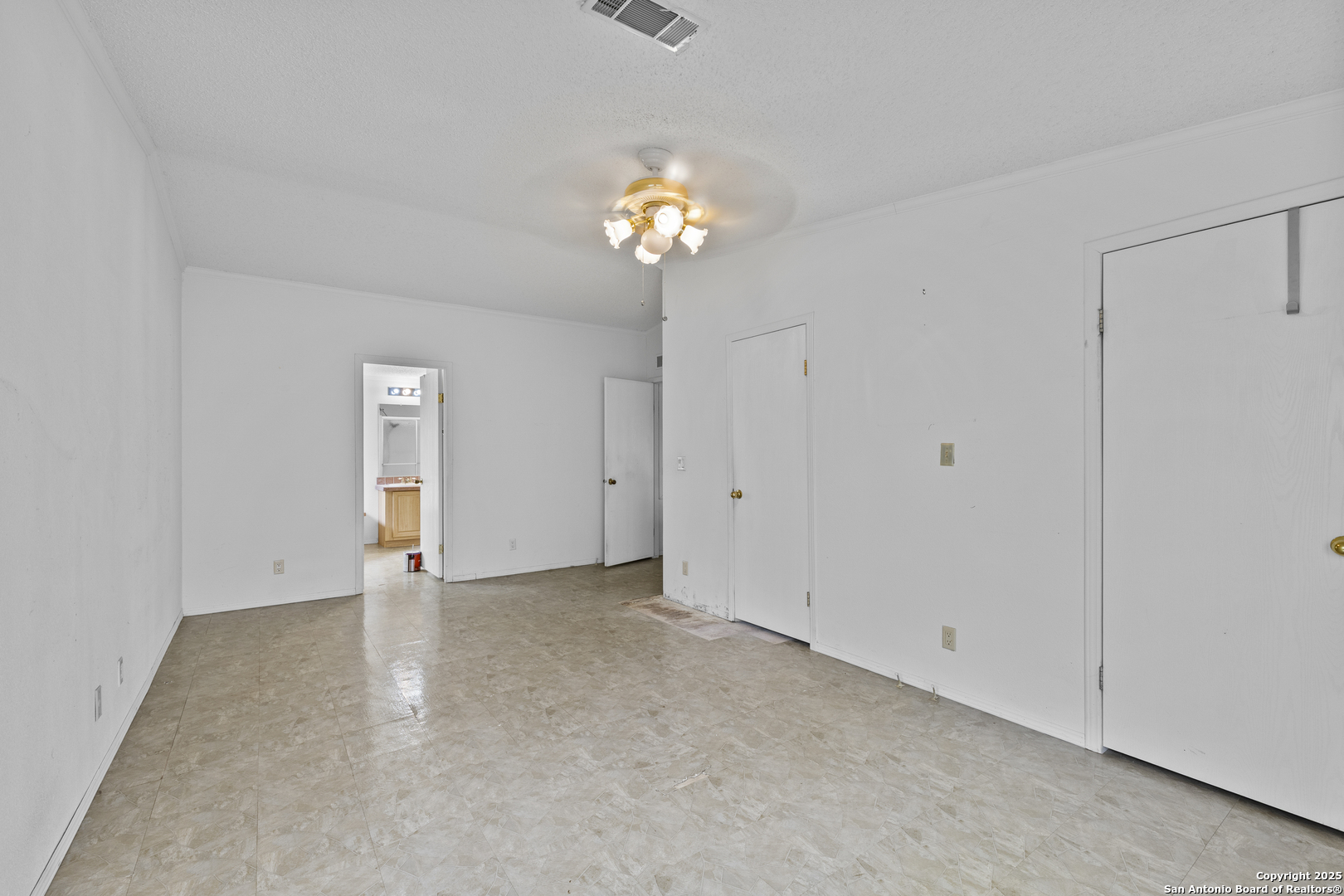 1189 Vivroux Ranch Road Seguin, TX 78155 - Photo 9 of 24 a view of an empty room with a chandelier fan