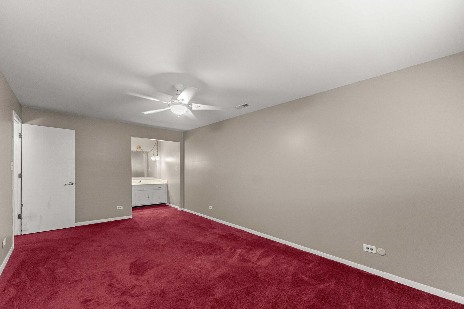 9122 South Pulaski Road, Unit 2E Oak Lawn, IL 60453 - Photo 10 of 16 an empty room with a ceiling fan and window