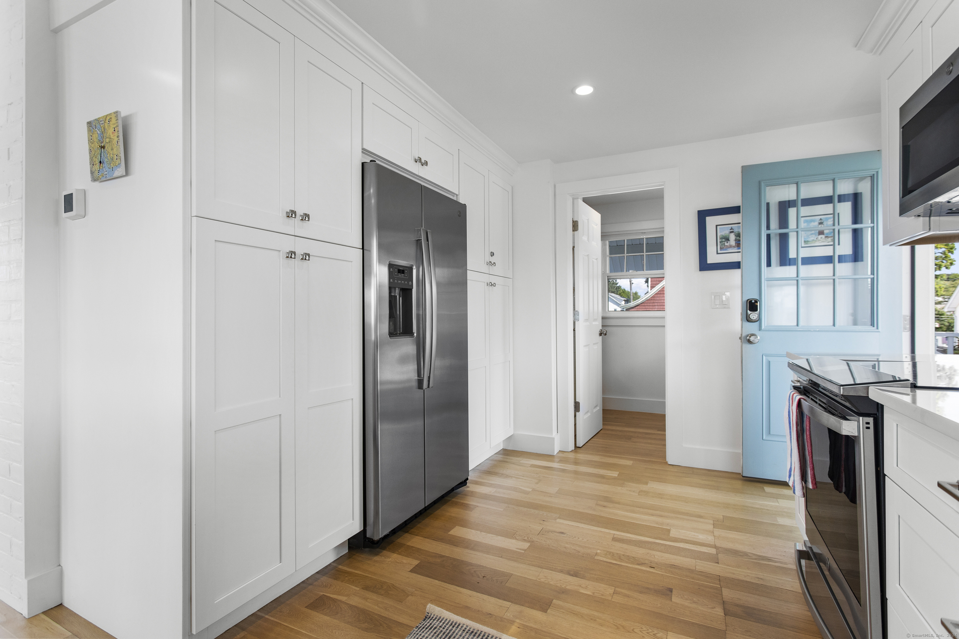15 Cottage Road Old Lyme, CT 06371 - Photo 9 of 26 a view of a kitchen with refrigerator and wooden floor