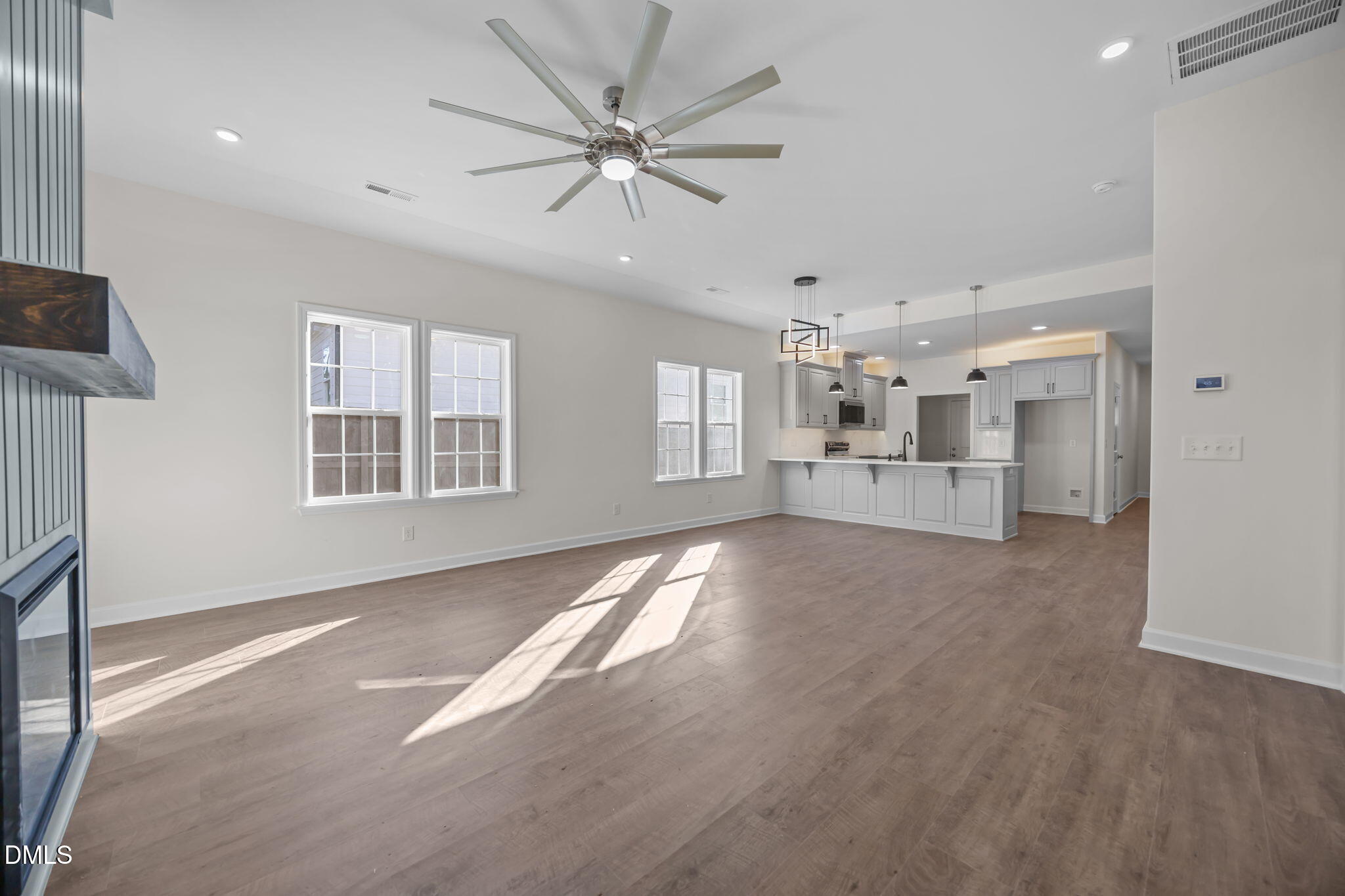 3505 Skycrest Drive Raleigh, NC 27604 - Photo 23 of 45 a view of an empty room with a window and kitchen view