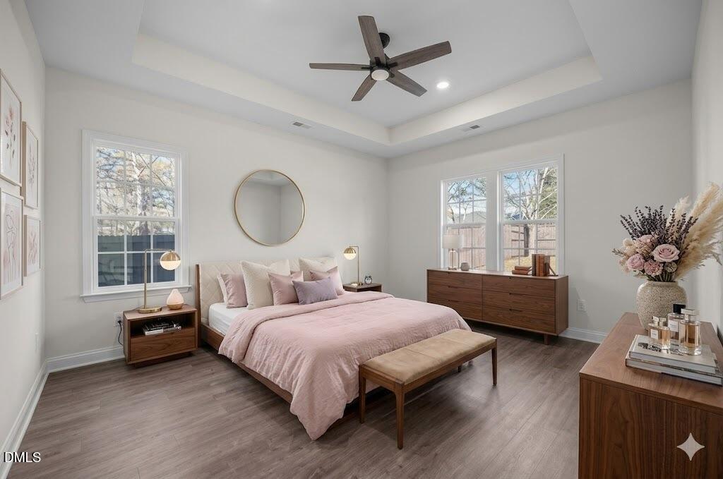 3505 Skycrest Drive Raleigh, NC 27604 - Photo 24 of 45 a bedroom with a bed couch and window