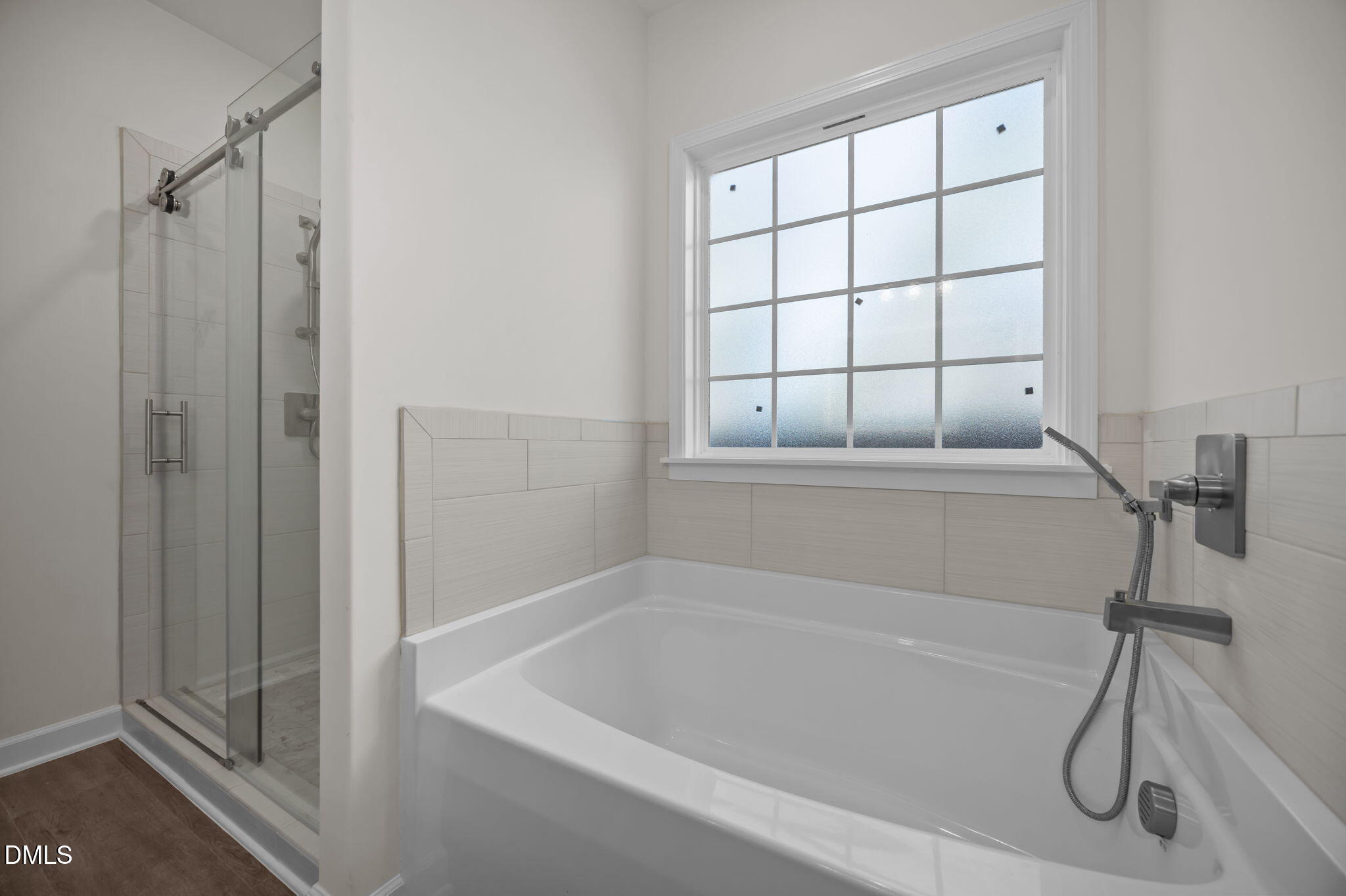 3505 Skycrest Drive Raleigh, NC 27604 - Photo 28 of 45 a bathroom with a bath tub and a shower