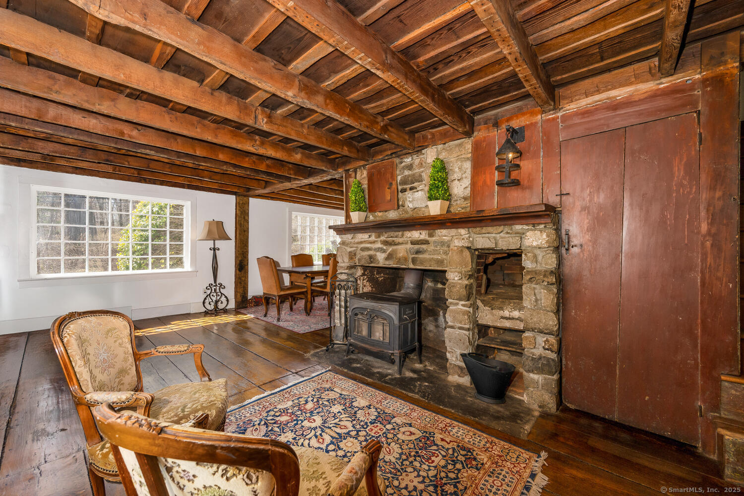 175 Mountain Road Wilton, CT 06897 - Photo 11 of 40 a living room with furniture and a fireplace