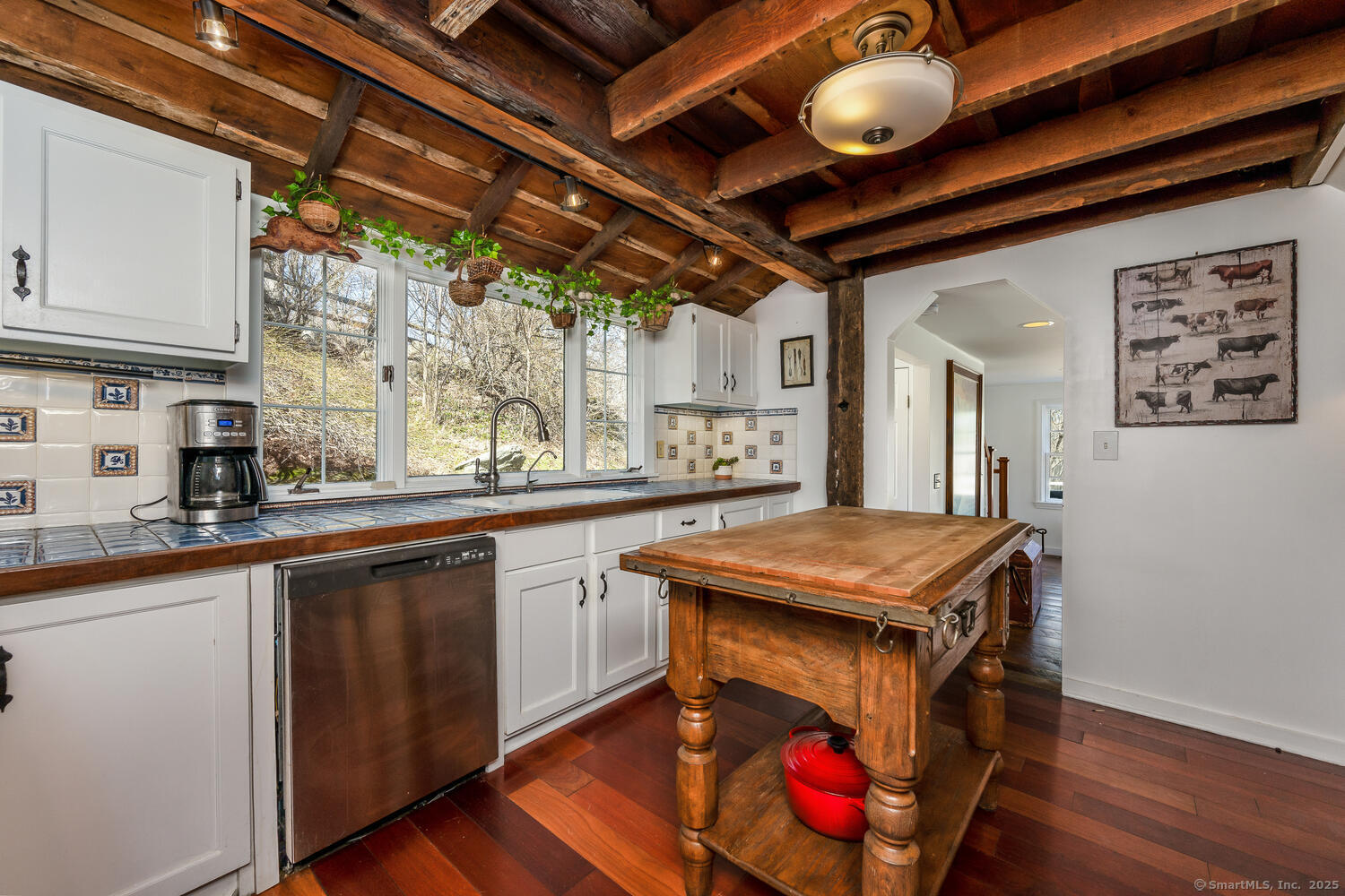 175 Mountain Road Wilton, CT 06897 - Photo 12 of 40 a kitchen with stainless steel appliances granite countertop a stove a sink dishwasher and cabinets with wooden floor