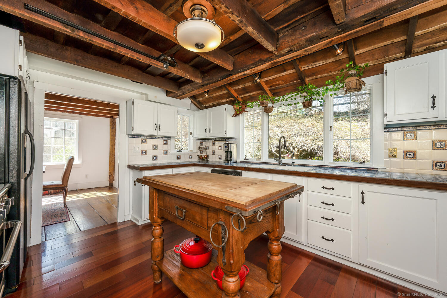 175 Mountain Road Wilton, CT 06897 - Photo 14 of 40 a kitchen with a stove a refrigerator and wooden floor