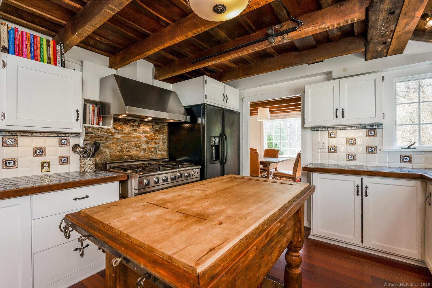 175 Mountain Road Wilton, CT 06897 - Photo 15 of 40 a kitchen with stainless steel appliances granite countertop a sink a stove and a refrigerator