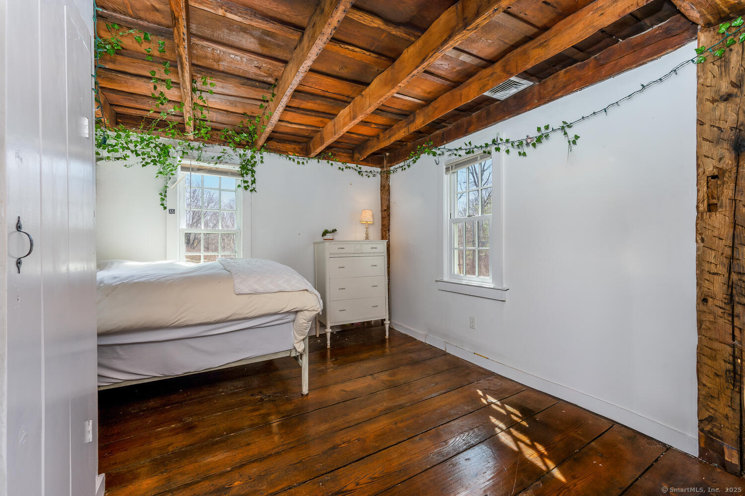 175 Mountain Road Wilton, CT 06897 - Photo 26 of 40 a bedroom with a bed and a window