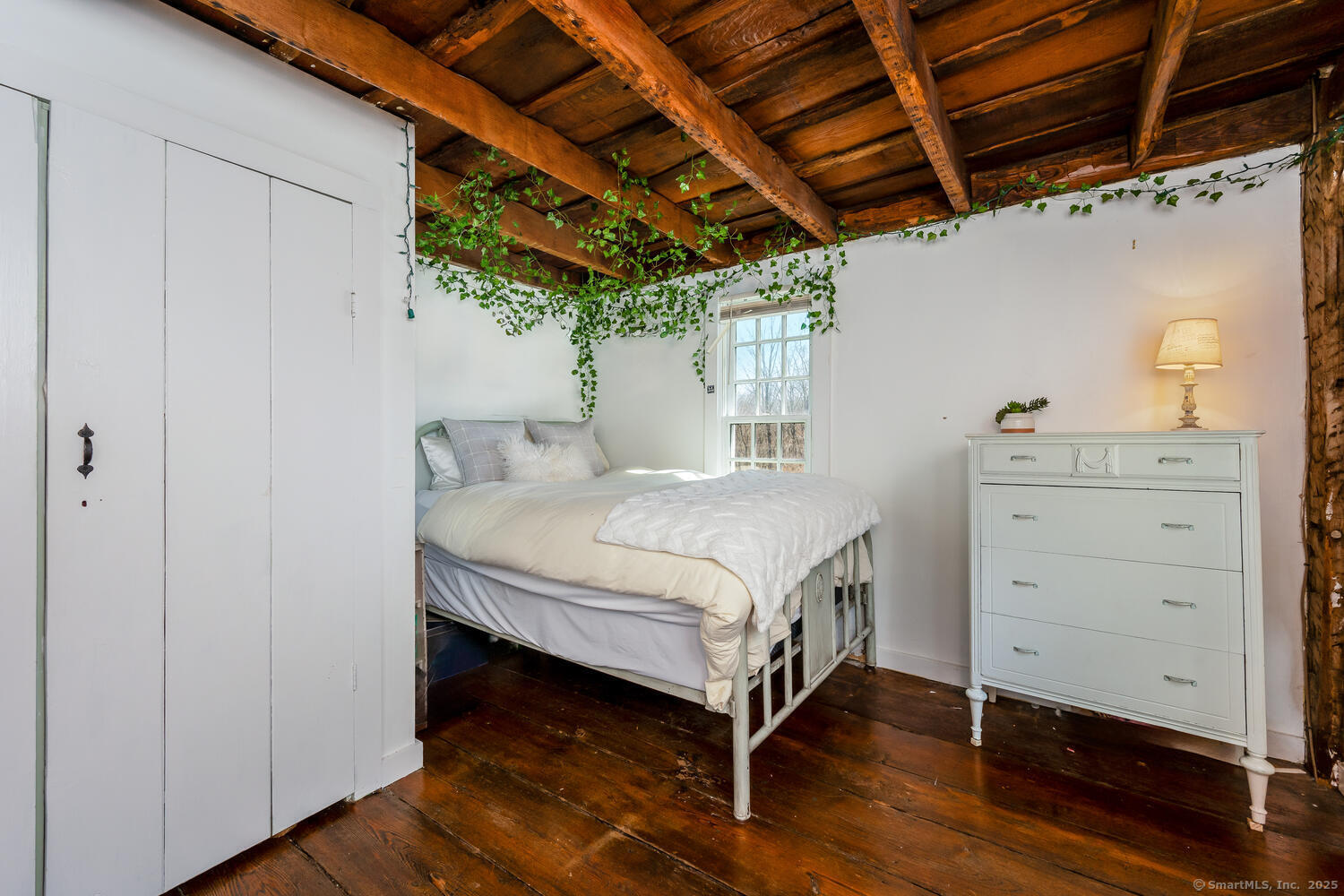 175 Mountain Road Wilton, CT 06897 - Photo 27 of 40 a bedroom with a bed and a dresser