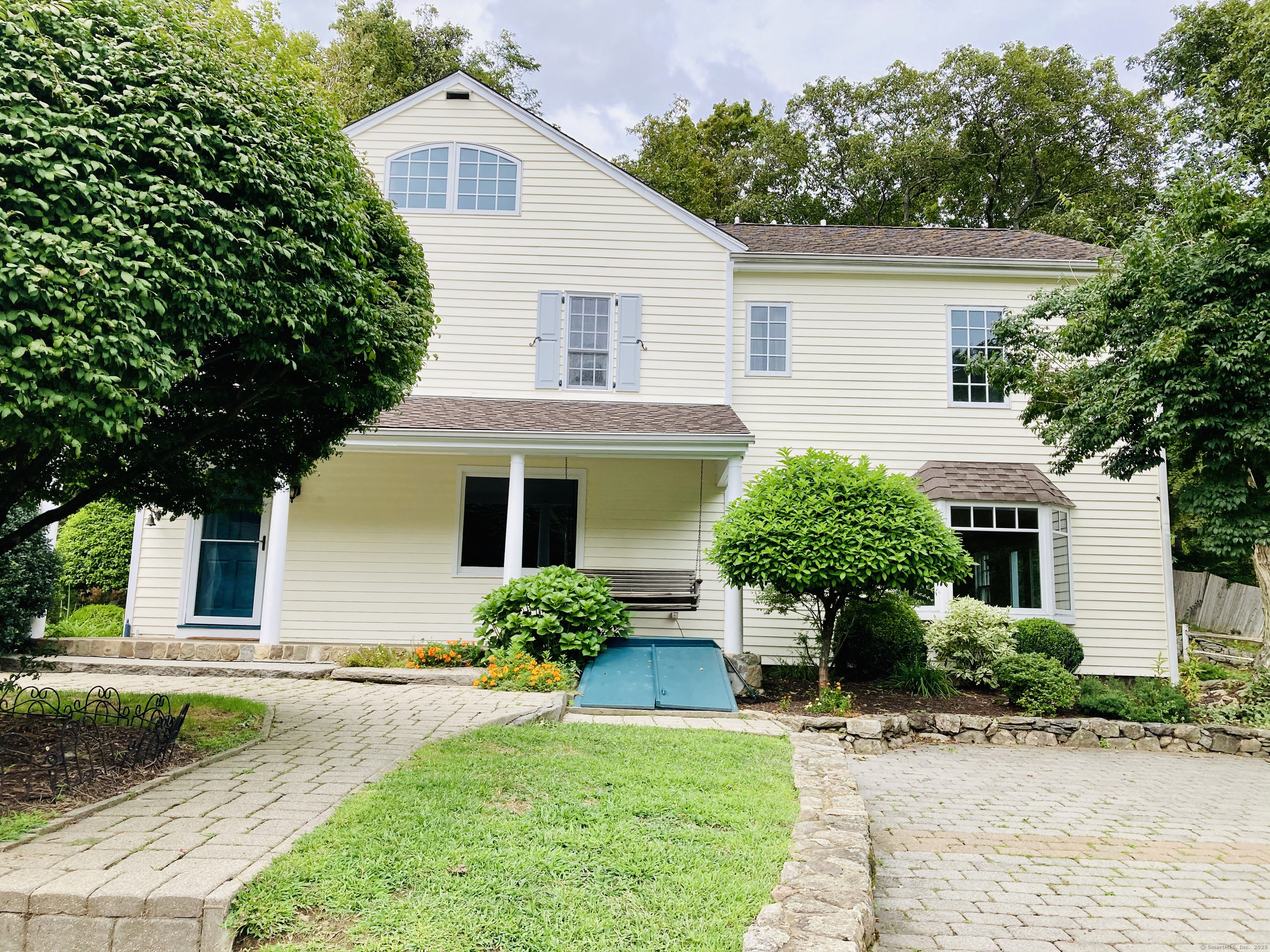 175 Mountain Road Wilton, CT 06897 - Photo 39 of 40 a front view of a house with yard and green space