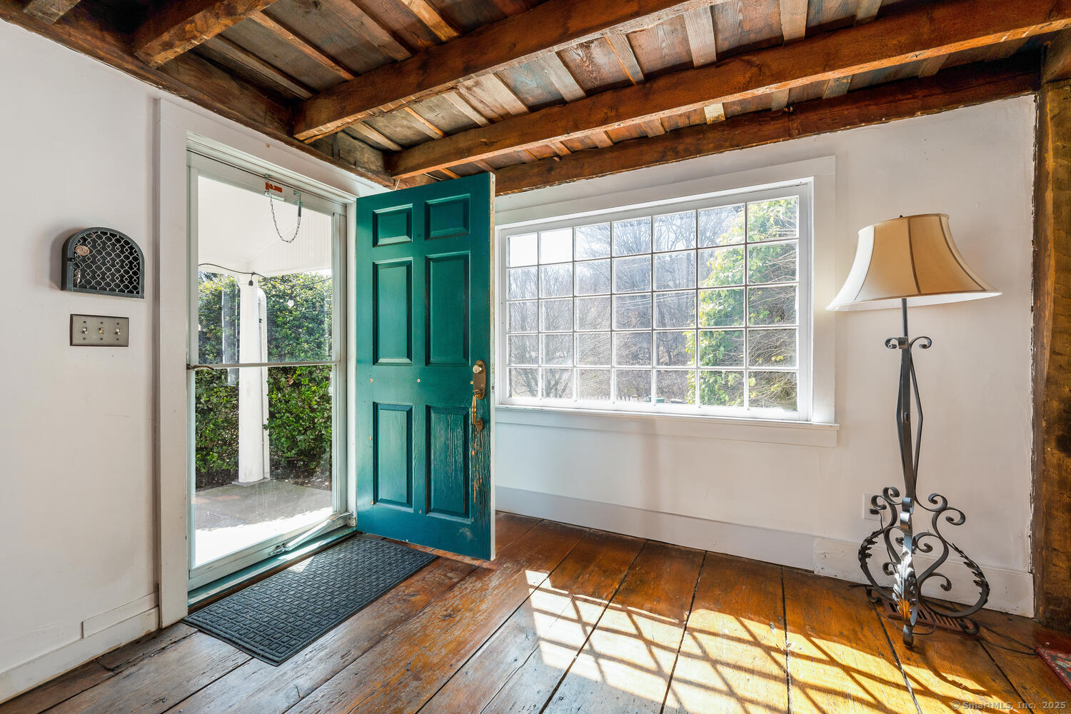 175 Mountain Road Wilton, CT 06897 - Photo 4 of 40 a view of an entryway with wooden floor and door
