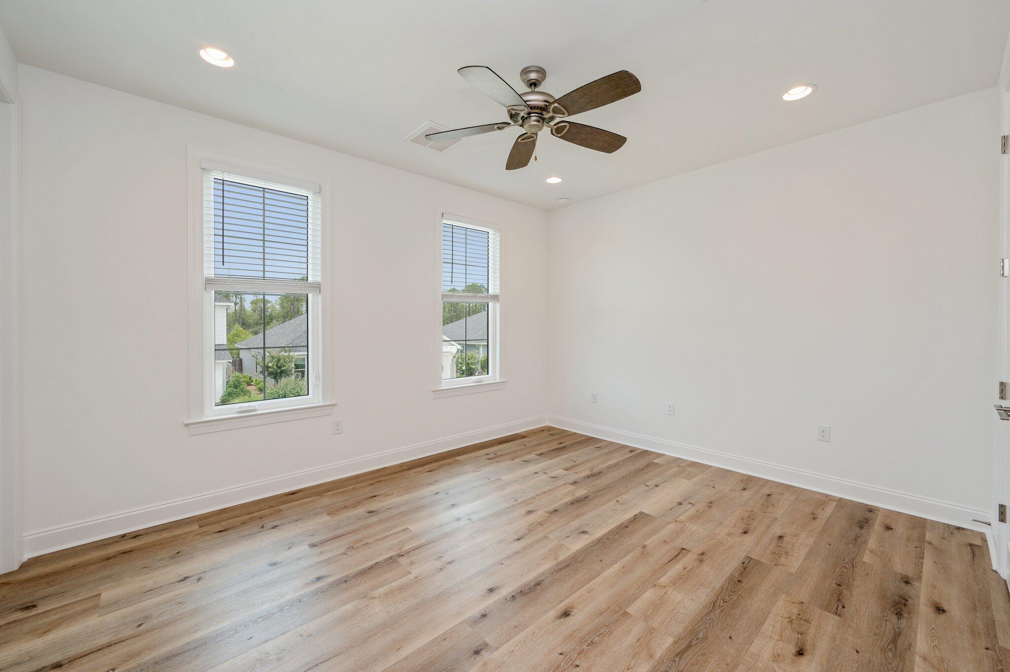 12 Windrow Way Inlet Beach Inlet Beach, FL 32461 - Photo 27 of 39 an empty room with wooden floor fan and windows
