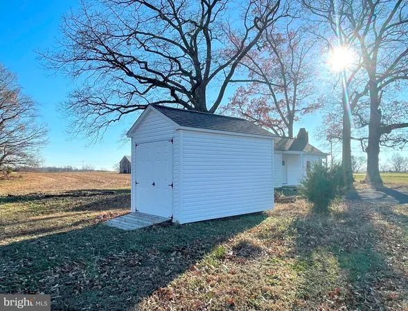 a view of a backyard of the house