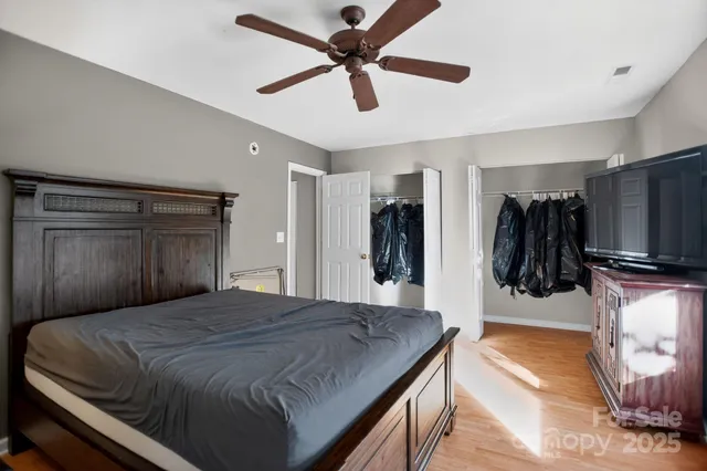 a bedroom with a bed and a walk in closet