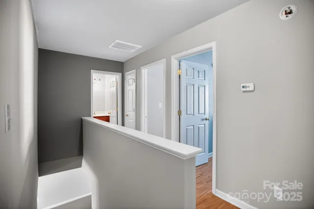 a view of a hallway with windows