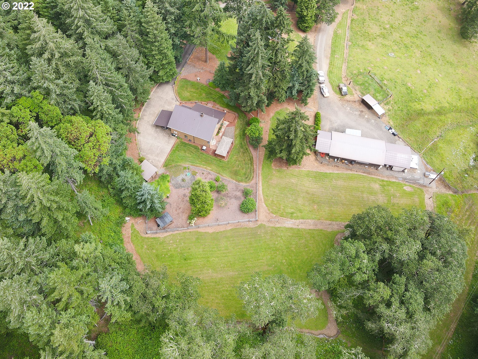 378 Racoon Road Oakland, OR 97462 - Photo 29 of 32 an aerial view of residential houses with outdoor space and trees all around