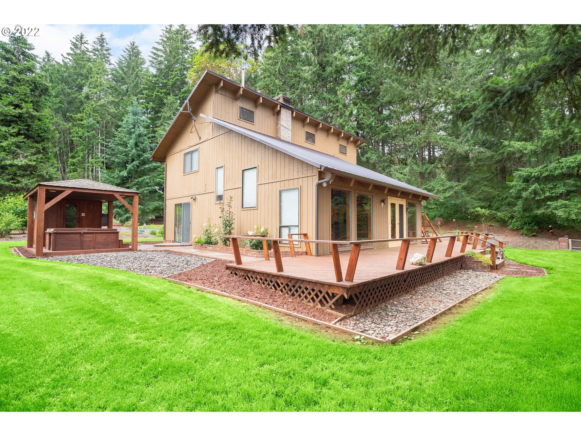 378 Racoon Road Oakland, OR 97462 - Photo 3 of 32 a view of a house with a yard and deck