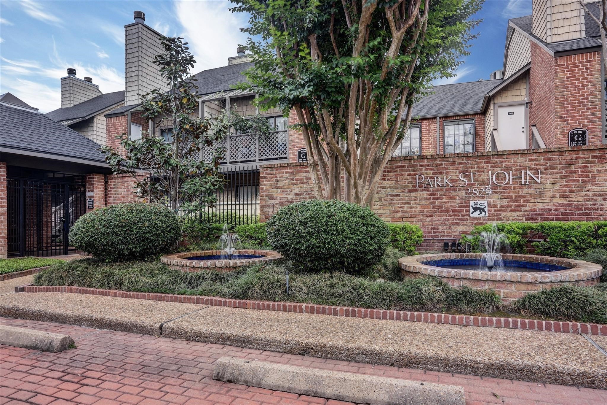 2829 Timmons Lane, Unit 202 Houston, TX 77027 - Photo 15 of 17 a front view of a house with garden