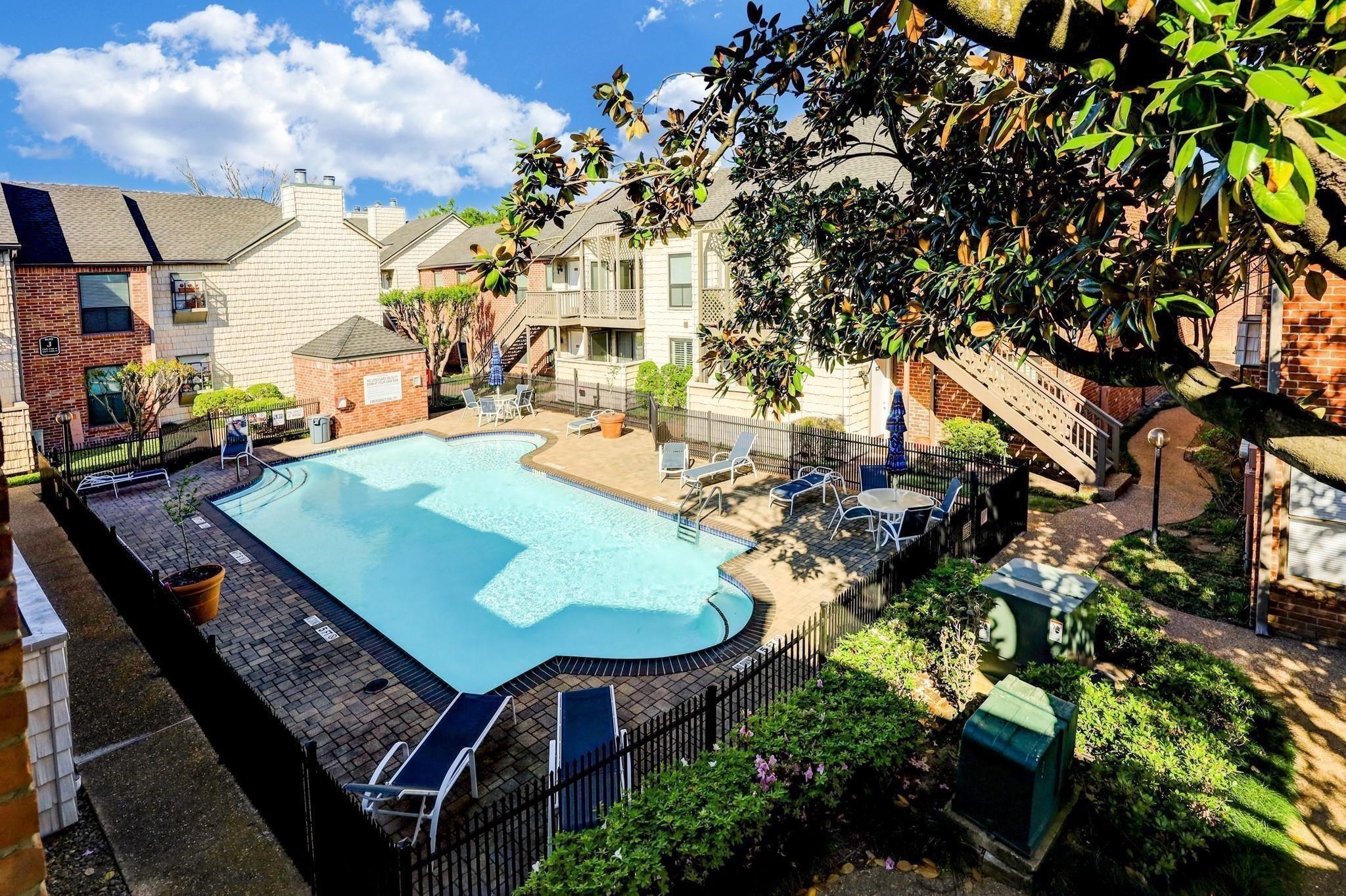2829 Timmons Lane, Unit 202 Houston, TX 77027 - Photo 16 of 17 a view of a balcony with chairs