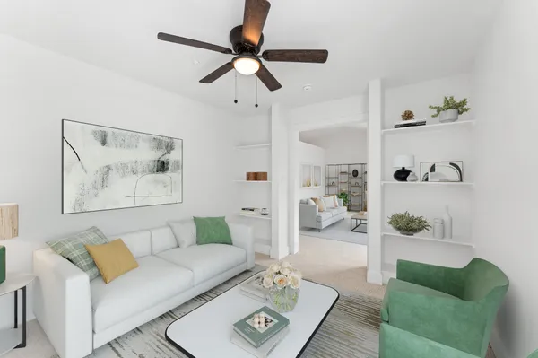 a living room with furniture and a rug