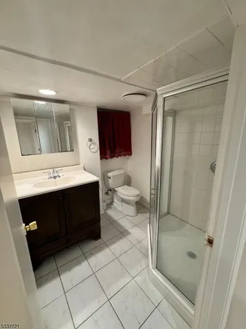 a bathroom with a double vanity sink and mirror