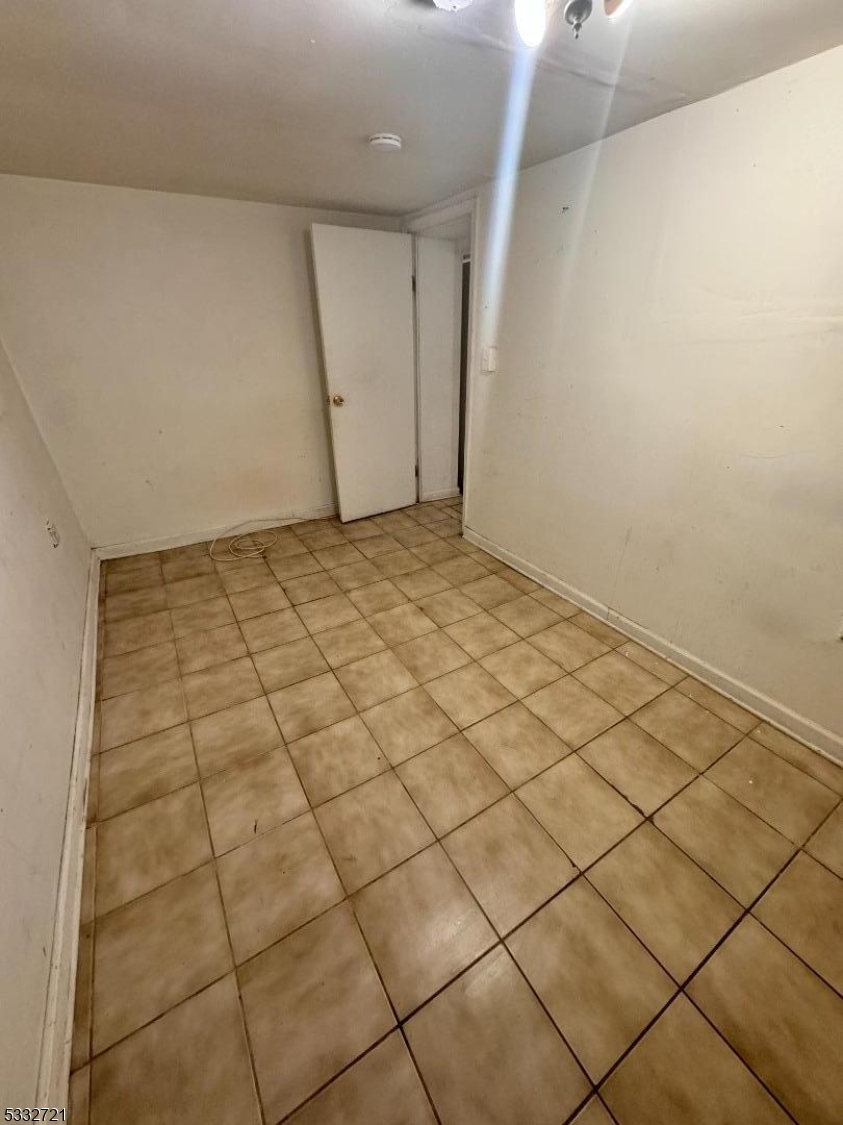233 Jackson Avenue Hackensack, NJ 07601 - Photo 7 of 8 a view of a livingroom and window