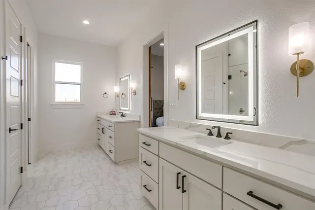 a bathroom with a shower and a sink