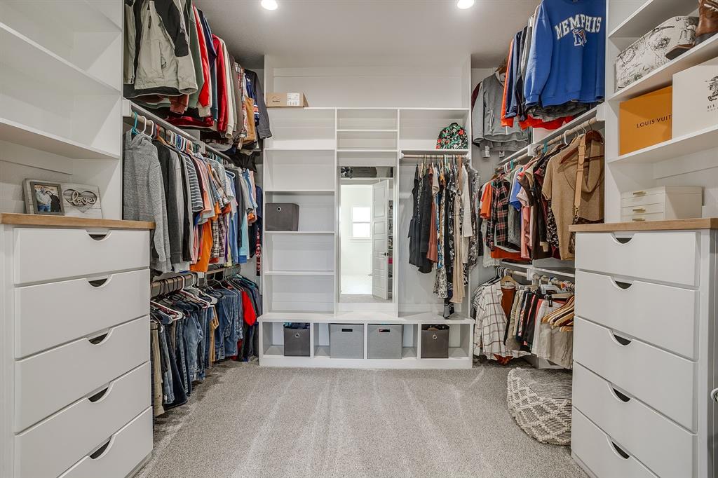 8140 Lavender Road Springtown, TX 76082 - Photo 25 of 40 a view of walk in closet with clothes and shoes