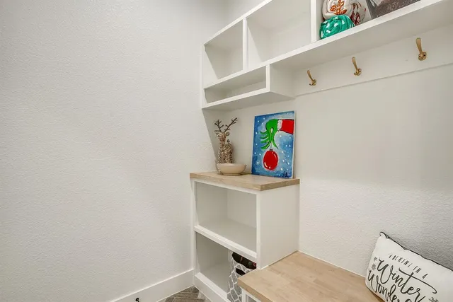 a view of a kitchen with furniture and a stove