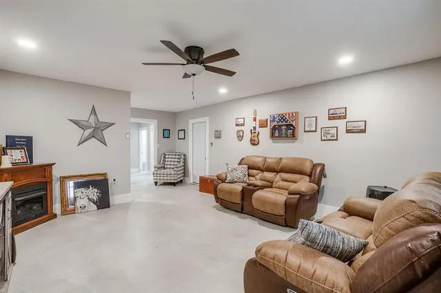 a view of a livingroom with furniture and an empty room