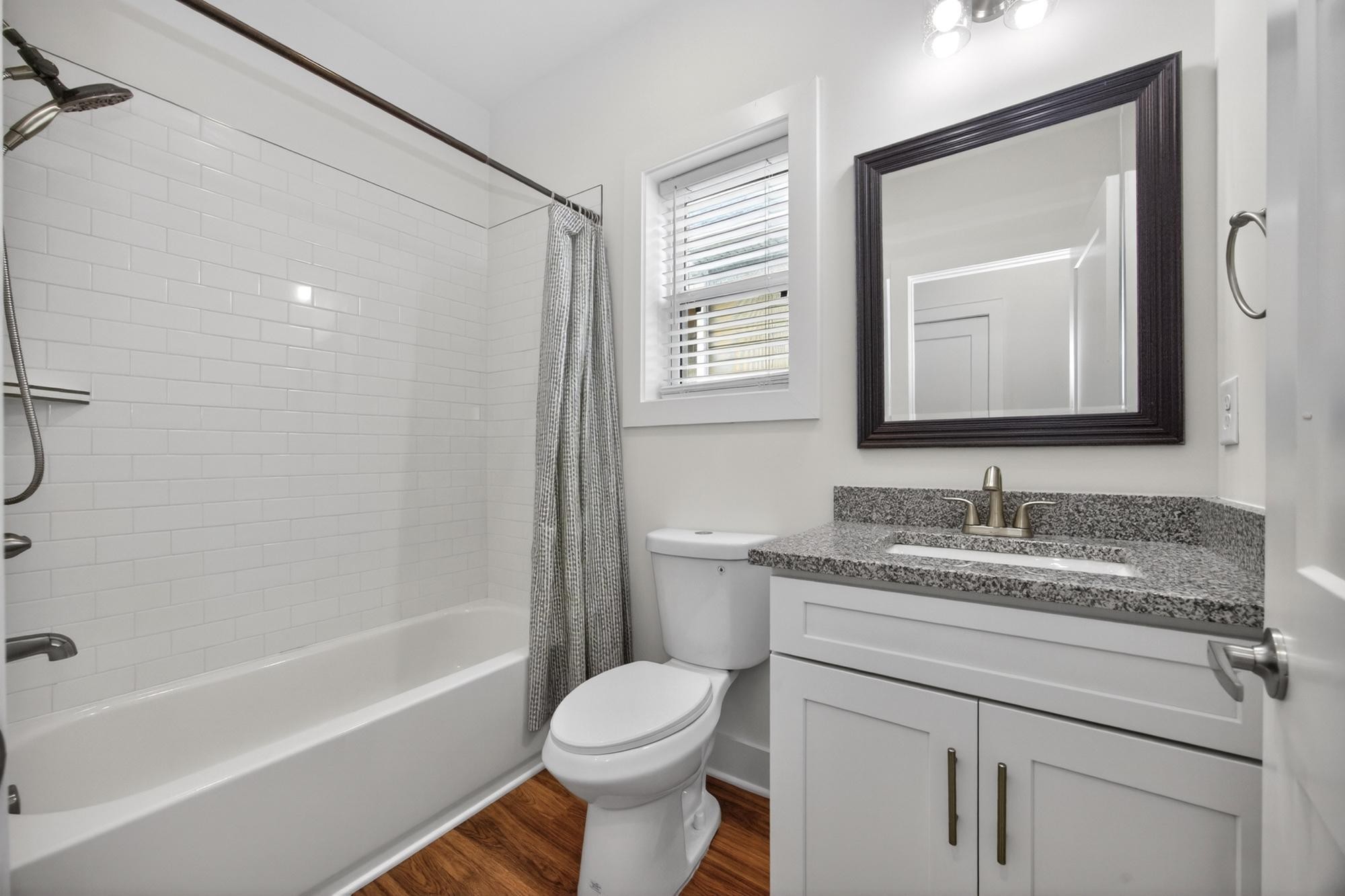 7 Decatur Street Nashville, TN 37210 - Photo 30 of 43 a bathroom with a granite countertop sink toilet and shower