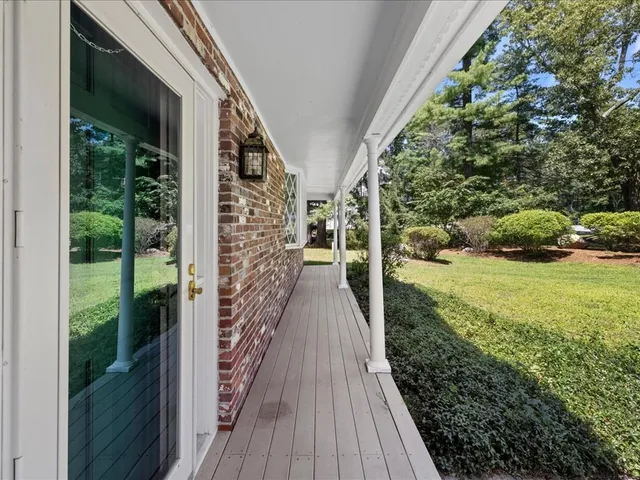 a view of a balcony with wooden floor