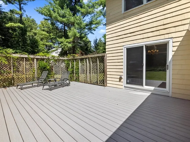 a view of a house with wooden deck