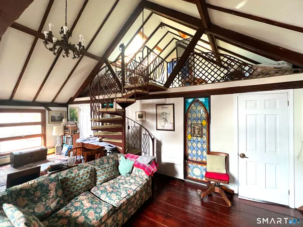 a view of an entryway with wooden floor