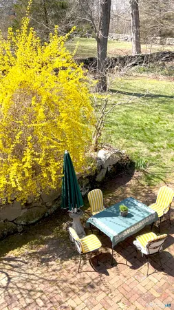 a backyard of a house with lots of green space
