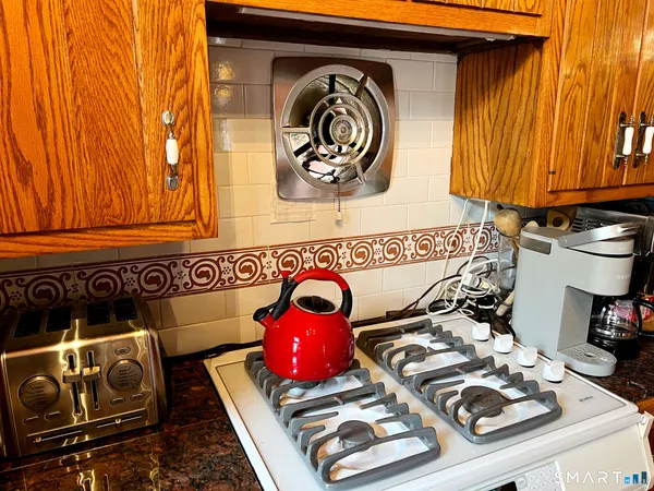 a front view of a door and chair in the kitchen