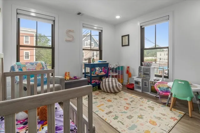 a bedroom with furniture and a window