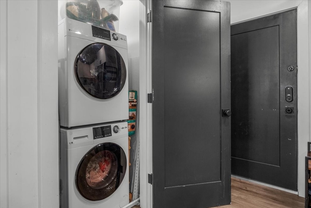 173 Magnolia Street, Unit 5 Boston, MA 02125 - Photo 18 of 23 a view of a hallway with washer and dryer
