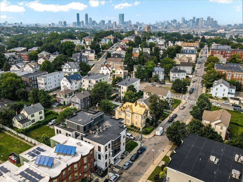 173 Magnolia Street, Unit 5 Boston, MA 02125 - Photo 2 of 23 an aerial view of residential houses with city view